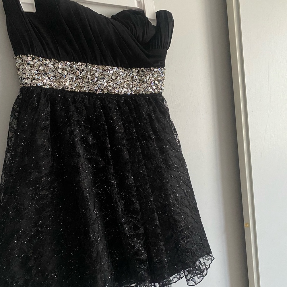 Strapless black dress with glitter and rhinestone details. Size 7
